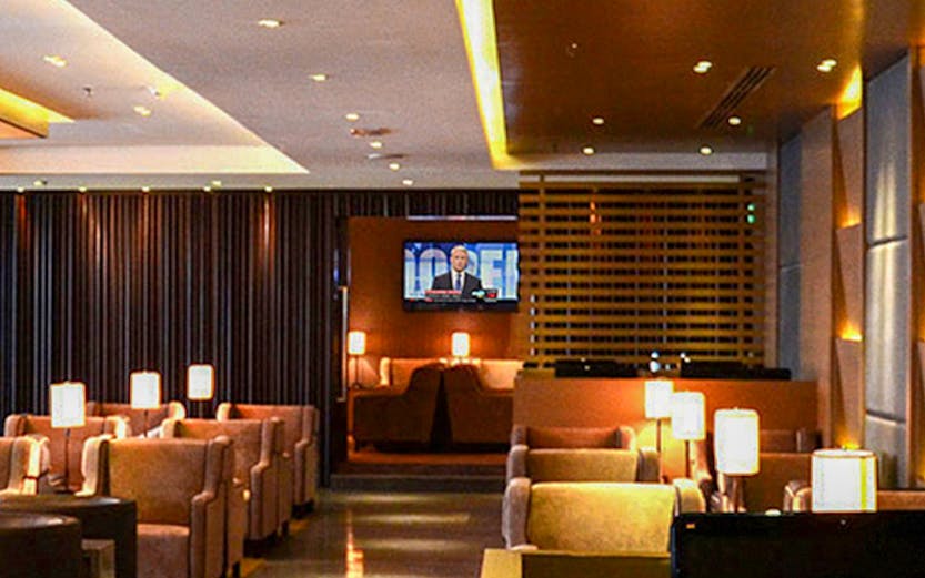 Lounge seating area with lamps at Kuala Lumpur International Airport.