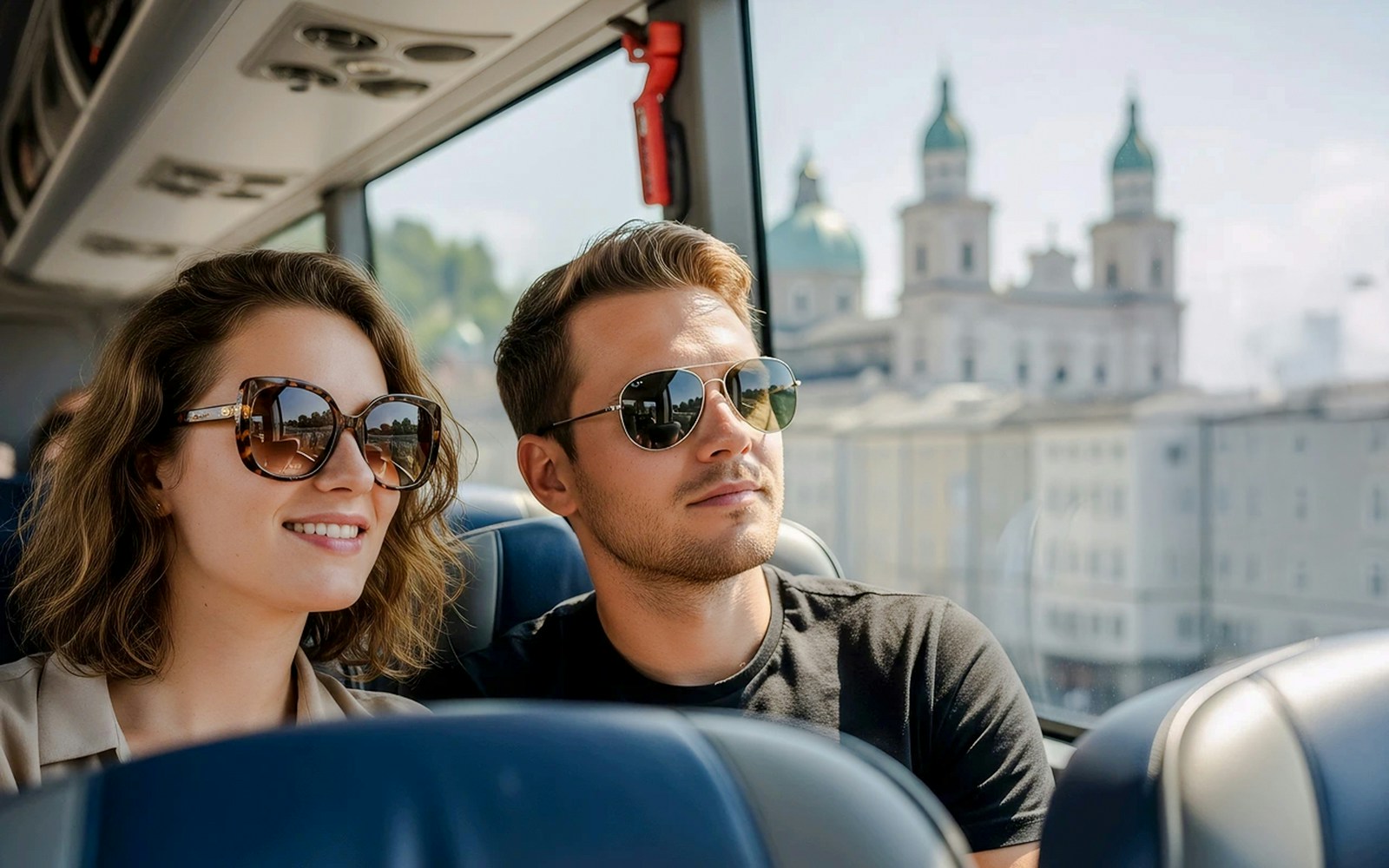 Passengers enjoying views of Salzburg from an AC coach, Austria.