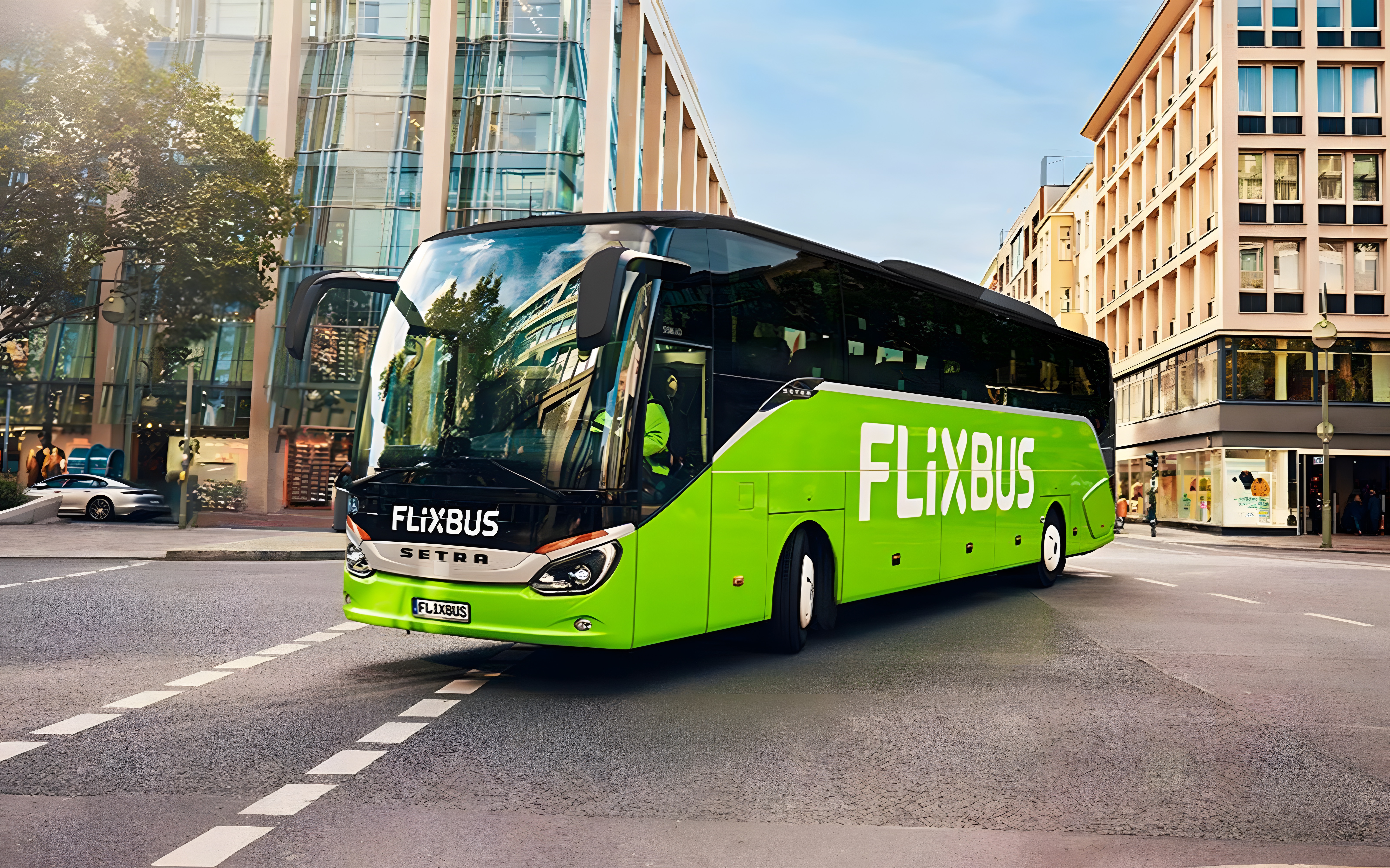 FlixBus in city street, Amsterdam to Efteling route.