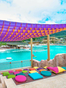 Colorful seating area overlooking pool at Blue Tree Water Park.