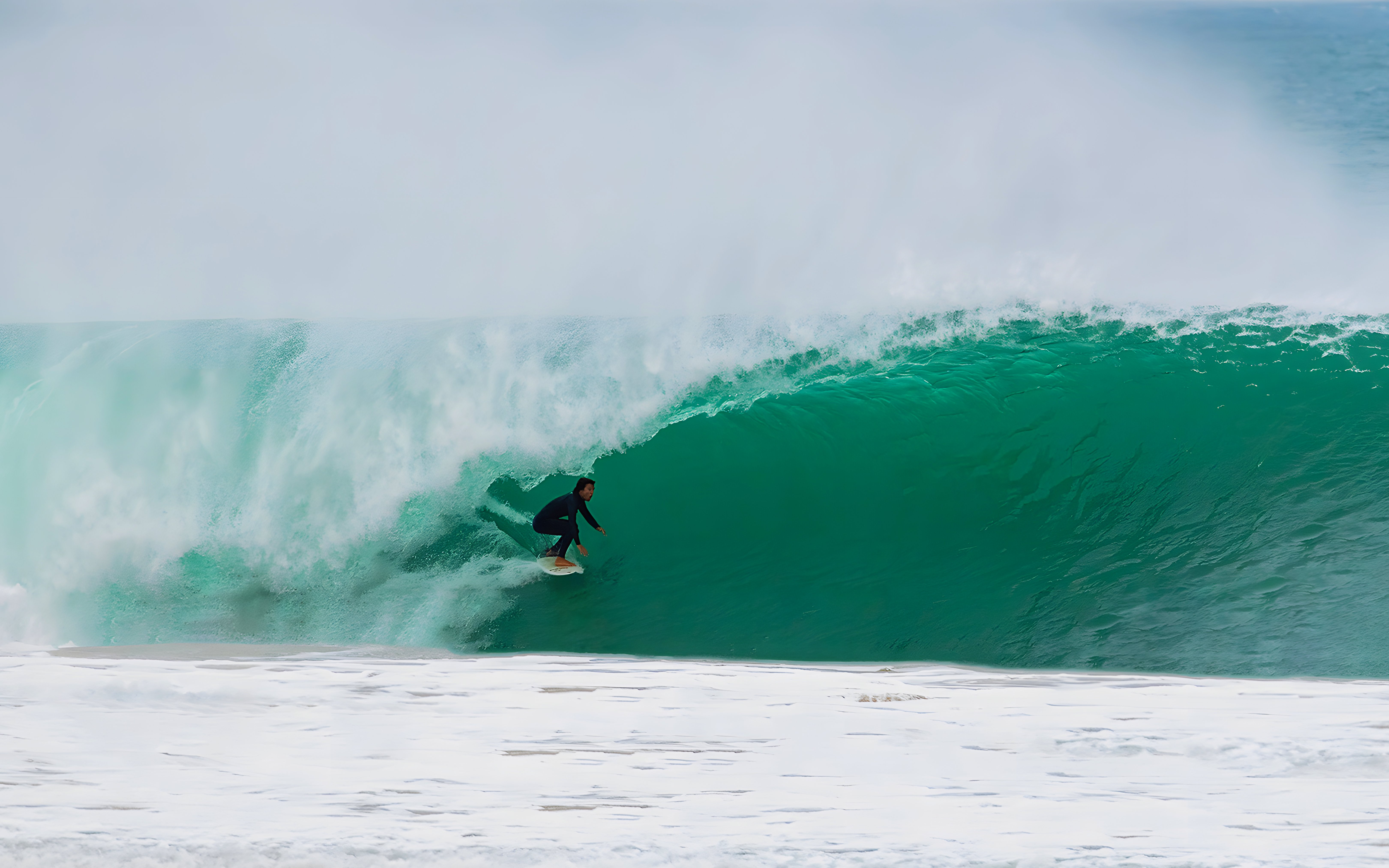 Surfer riding a wave in Lisbon, Portugal.