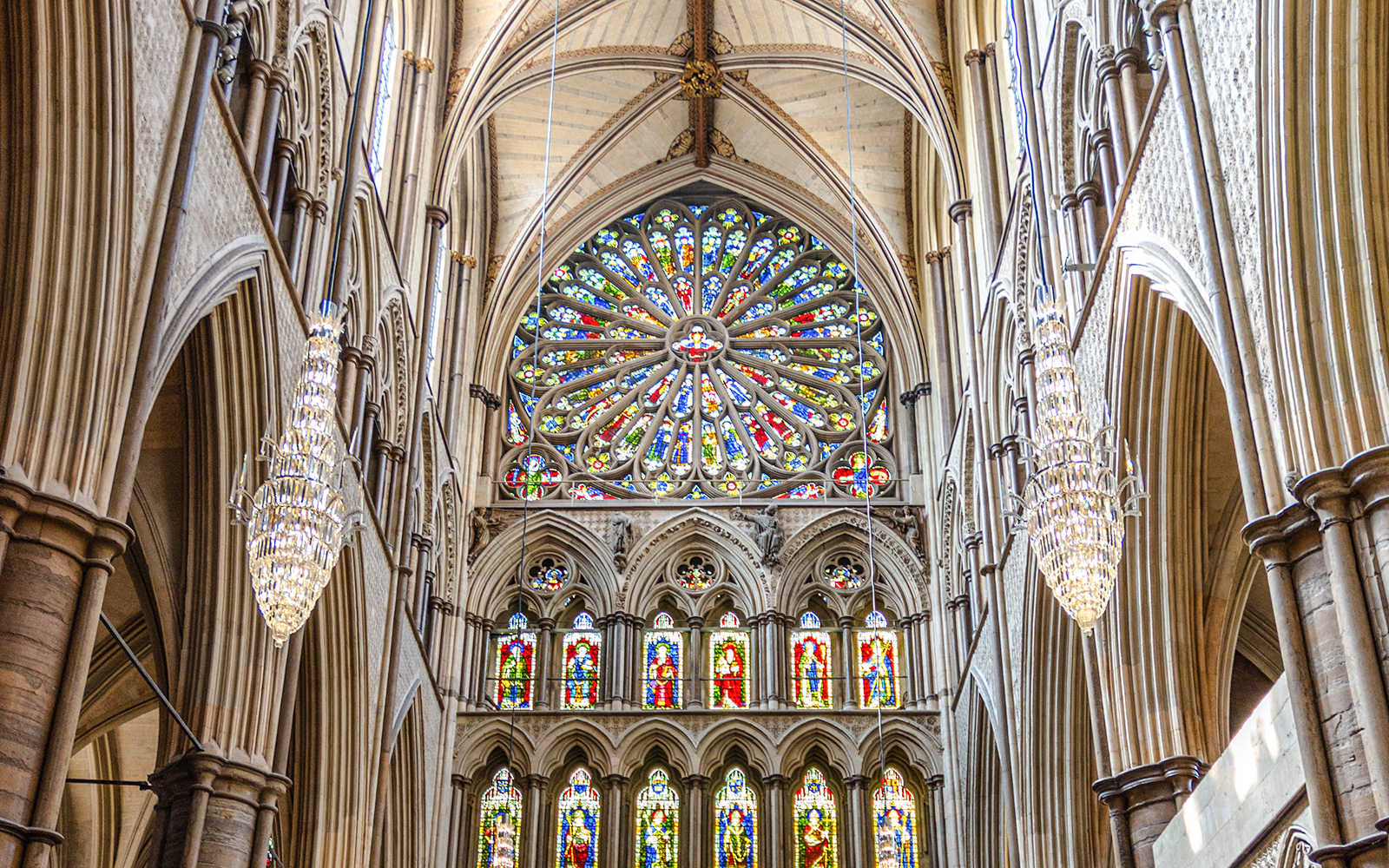 Stained glass rose window in the south transept of Westminster Abbey, London.
