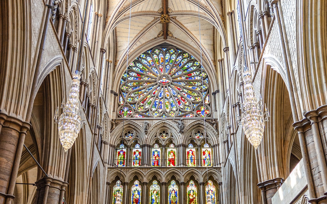 Stained glass rose window in the south transept of Westminster Abbey, London.