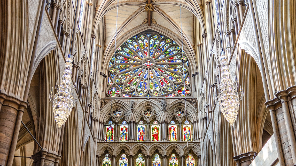 Stained glass rose window in the south transept of Westminster Abbey, London.