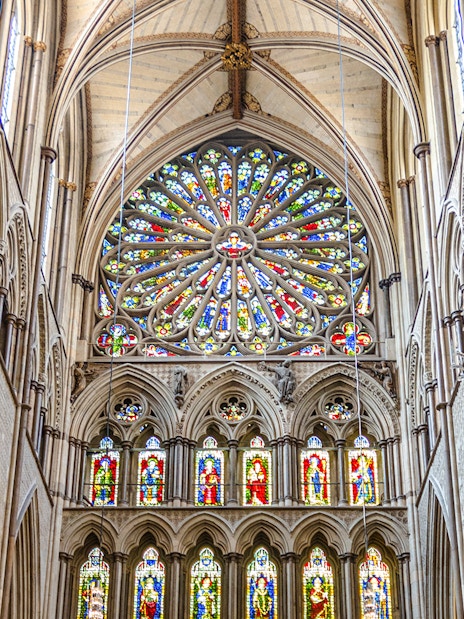 Stained glass rose window in the south transept of Westminster Abbey, London.