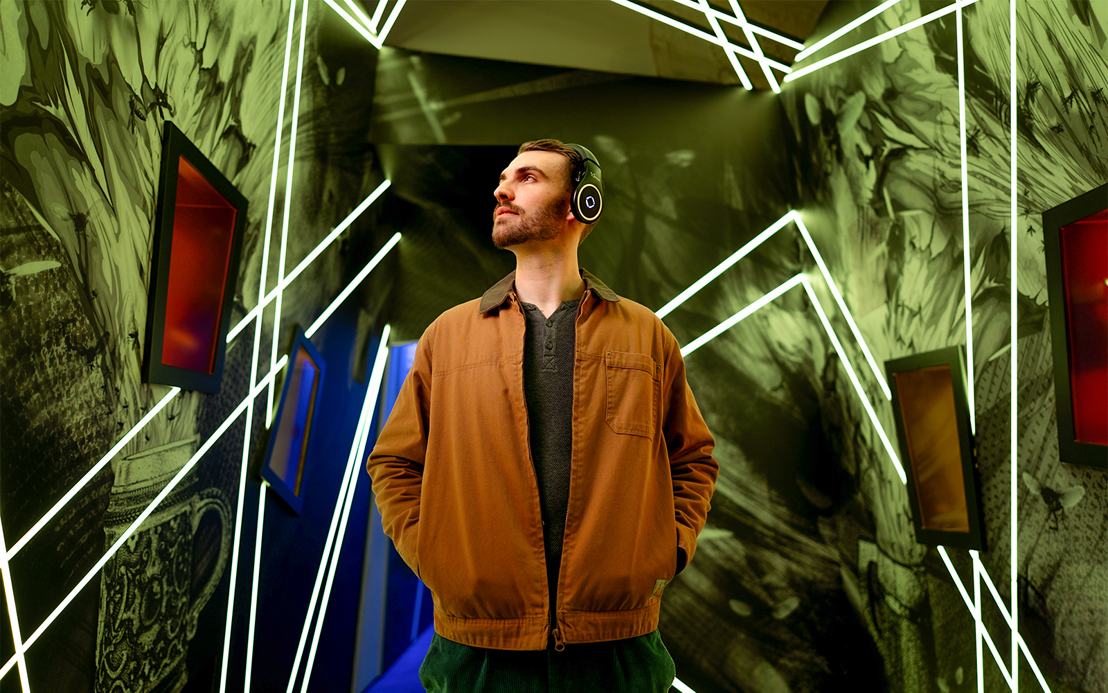 Man exploring interactive exhibit at Prague Pilsner Urquell Experience.