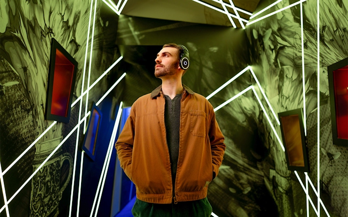 Man exploring interactive exhibit at Prague Pilsner Urquell Experience.