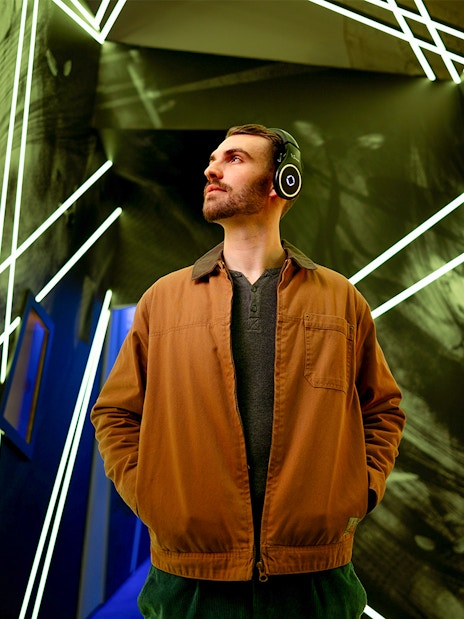 Man exploring interactive exhibit at Prague Pilsner Urquell Experience.