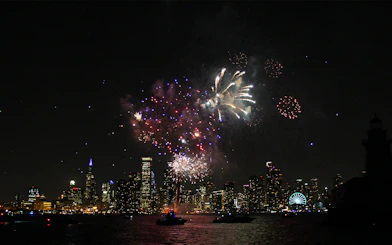 Fireworks over Chicago skyline during dinner cruise on Lake Michigan.