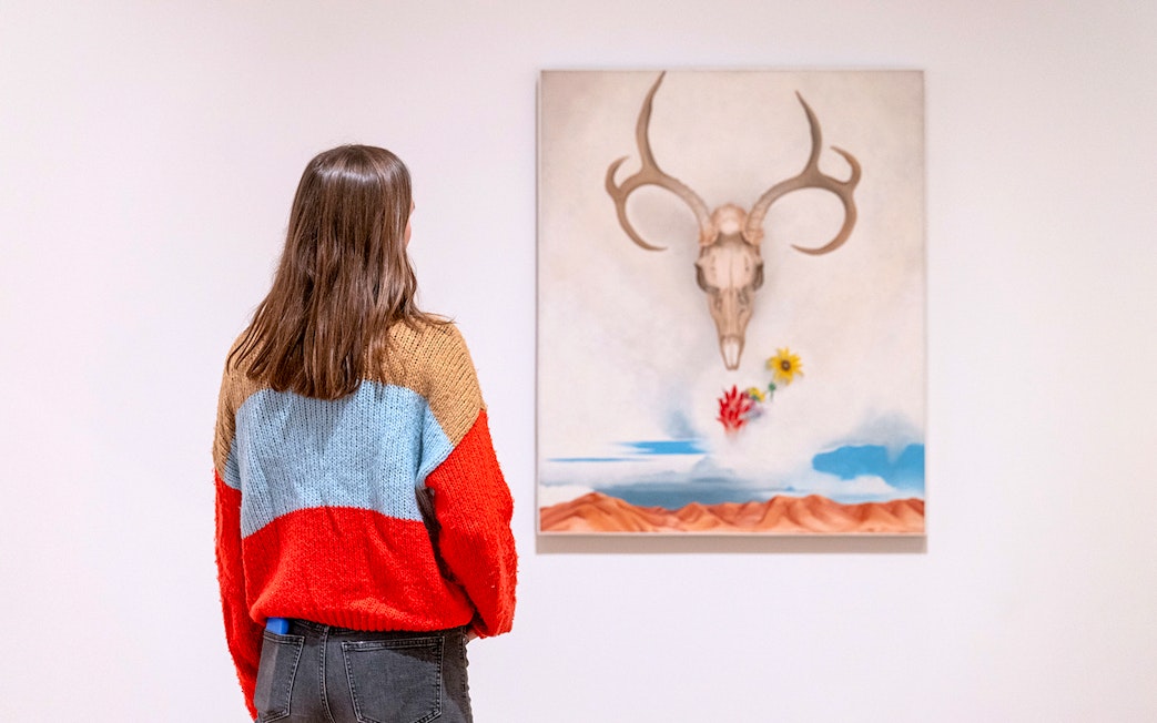 Guest viewing "Summer Days" by Georgia O'Keeffe at Whitney Museum of American Art.