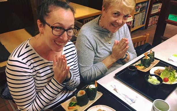 Guests enjoying sushi on Mt. Fuji food tour with bullet train ride.