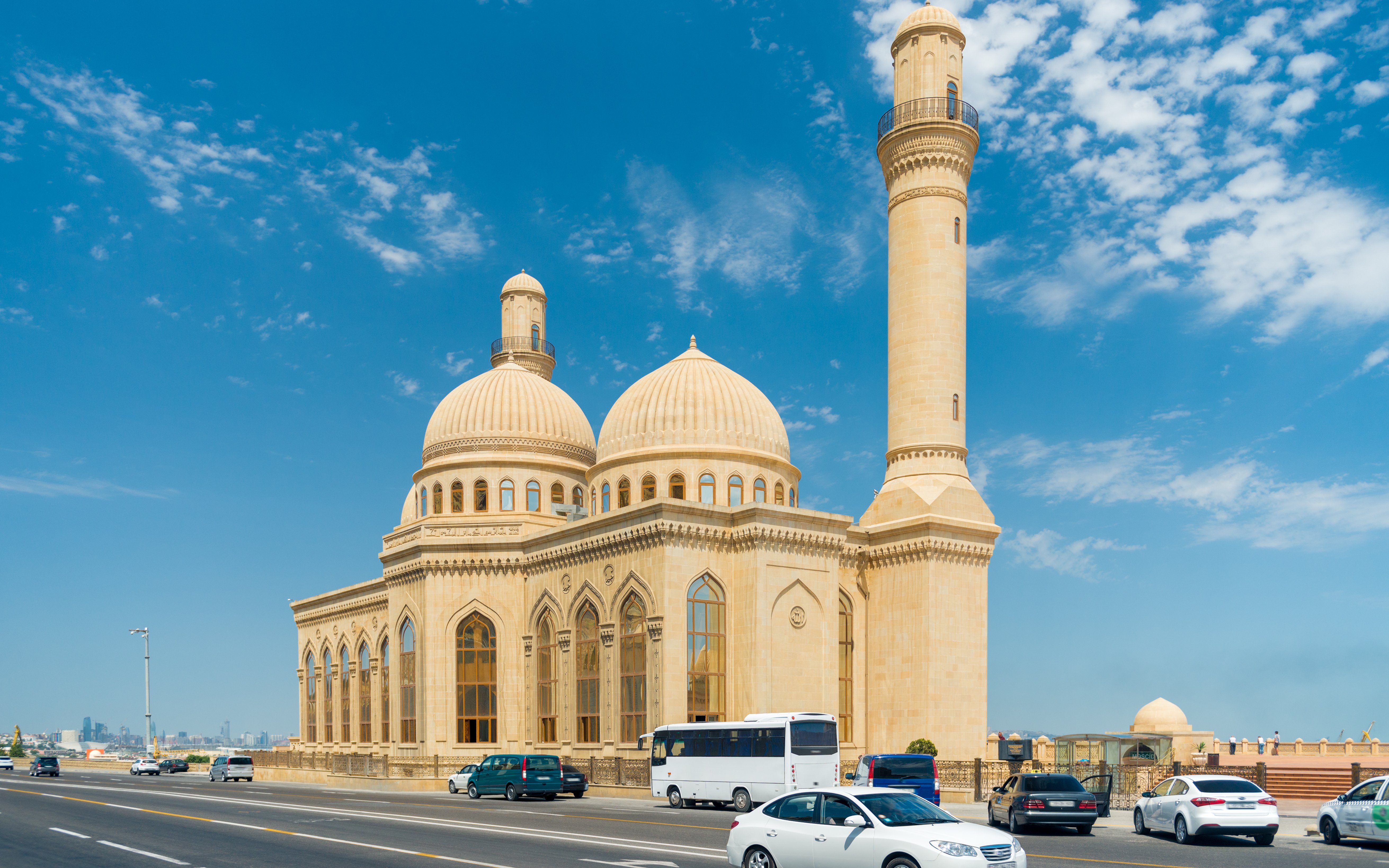 Bibi-Heybat Mosque with domes and minaret under blue sky, Baku, Azerbaijan.
