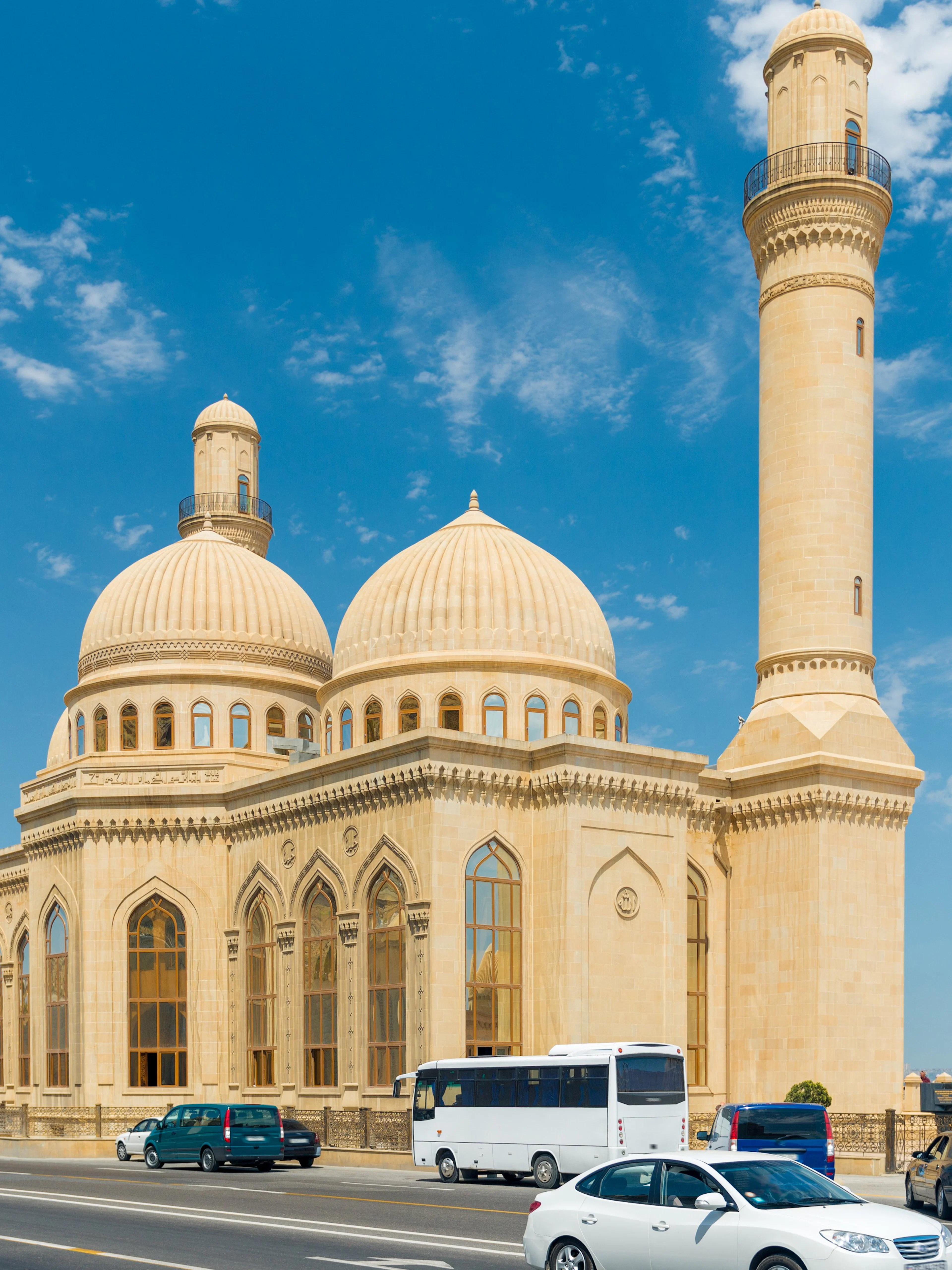 Bibi-Heybat Mosque with domes and minaret under blue sky, Baku, Azerbaijan.