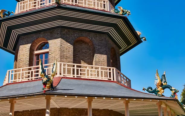 Great Pagoda at Kew Gardens with ornate dragon sculptures, London.