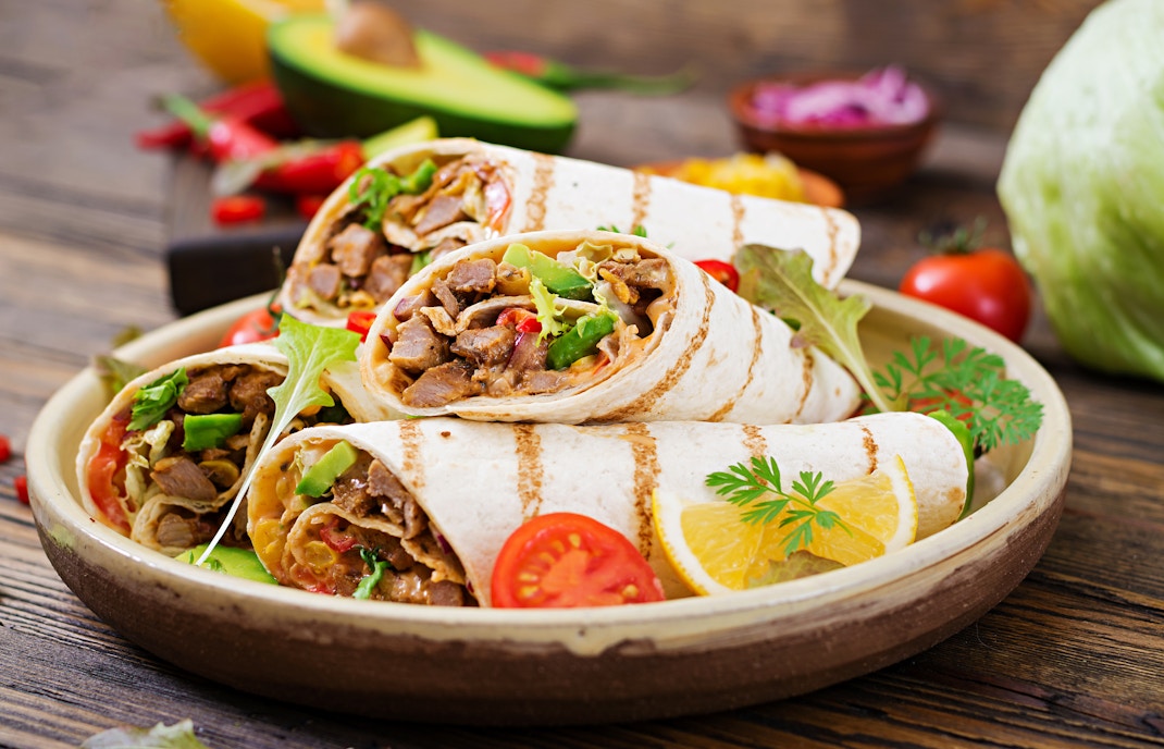 Delicious Mexican burritos served during a food tasting tour in Port Aventura
