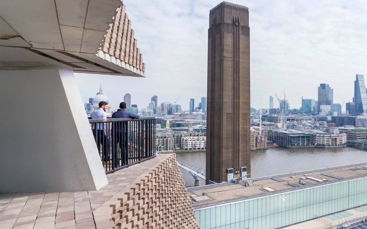 View of Tate Modern and London skyline from a balcony.