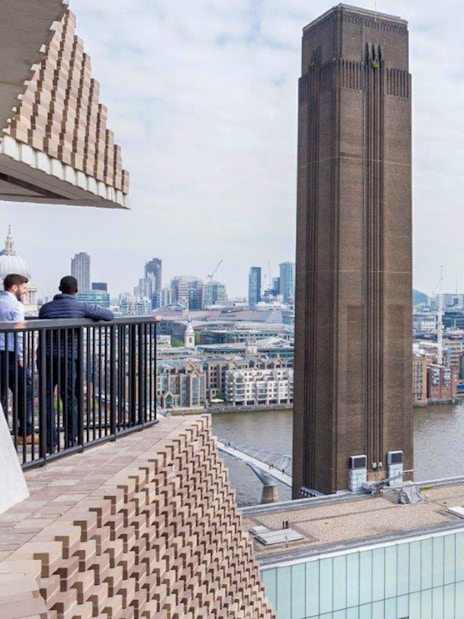 View of Tate Modern and London skyline from a balcony.