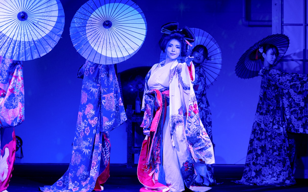 Dancers in kimonos with parasols at Tokyo Tower's Traditional Japan Festival Dance Show.