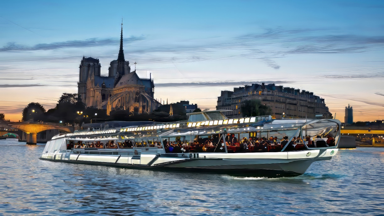 Seine River dinner cruise with couples dining in Paris.