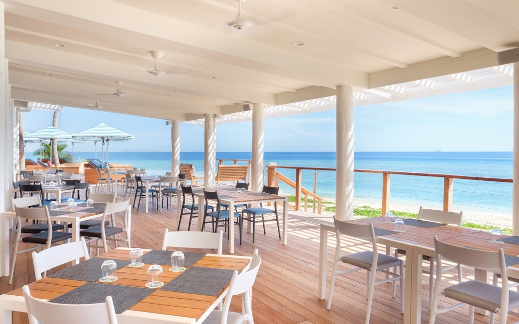 Dining area of Malamala Beach Club overlooking ocean, Fiji.