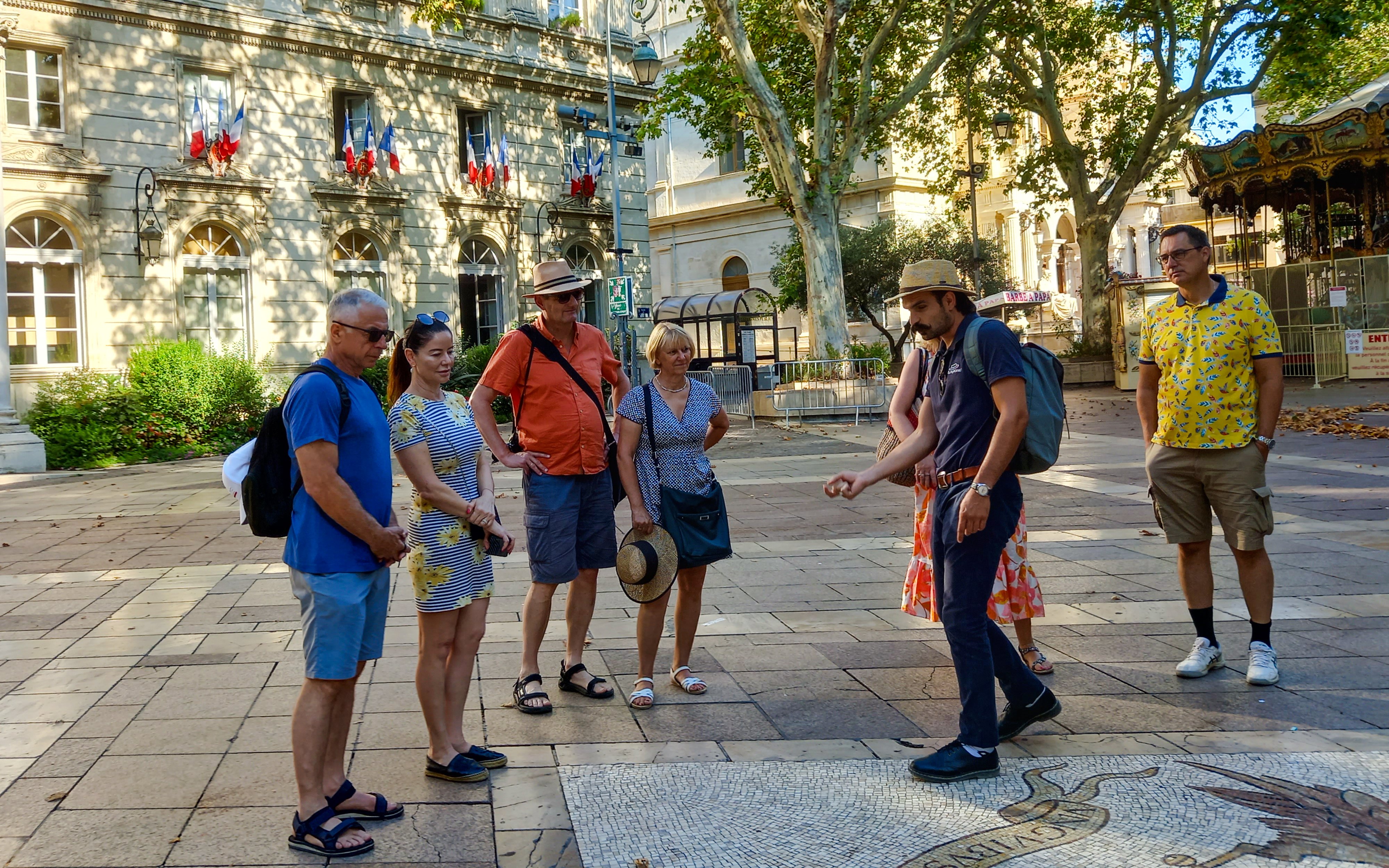 Tour group with guide in front of Popes' Palace, Avignon.