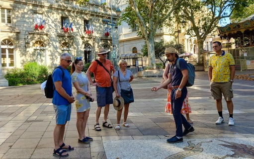 Tour group with guide in front of Popes' Palace, Avignon.