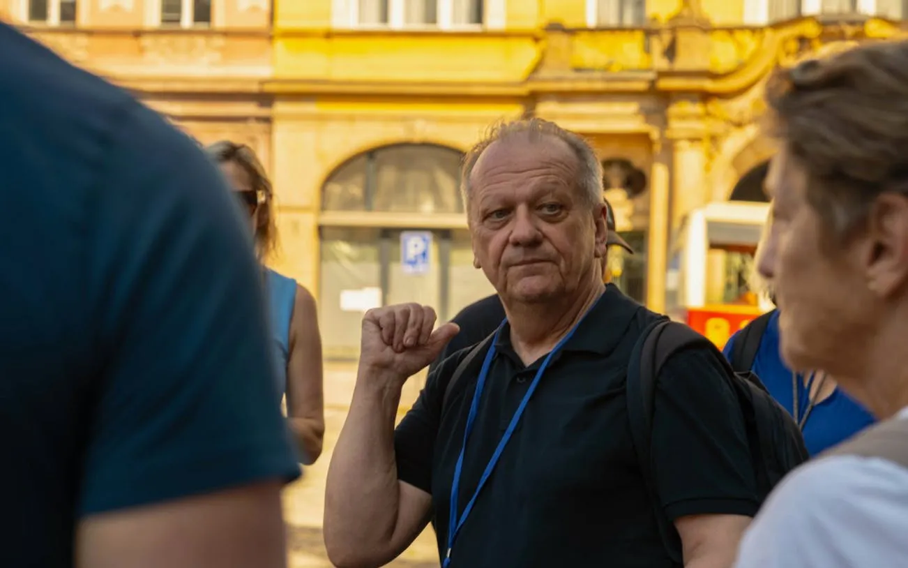 Local guide leading a small-group walking tour in Prague.