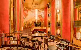 Radio City Music Hall interior with art deco design and grand staircase.