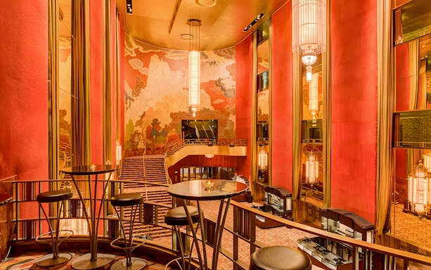 Radio City Music Hall interior with art deco design and grand staircase.