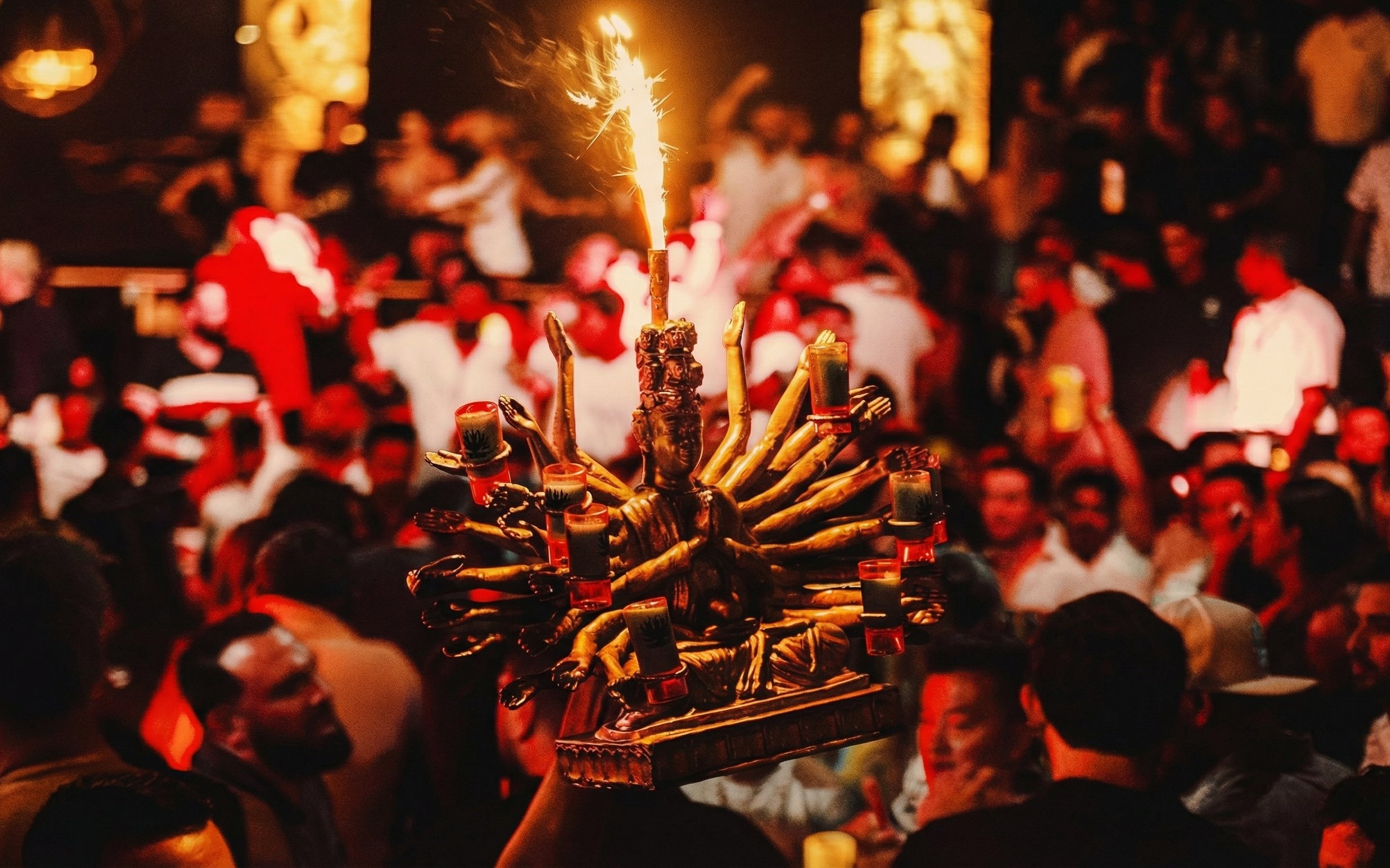 Crowded dance floor at Mandala Nightclub Cancun with vibrant decor and lively atmosphere.