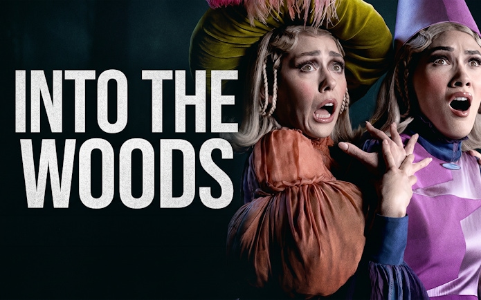 Actors in costume express surprise in a scene from "Into the Woods" musical.