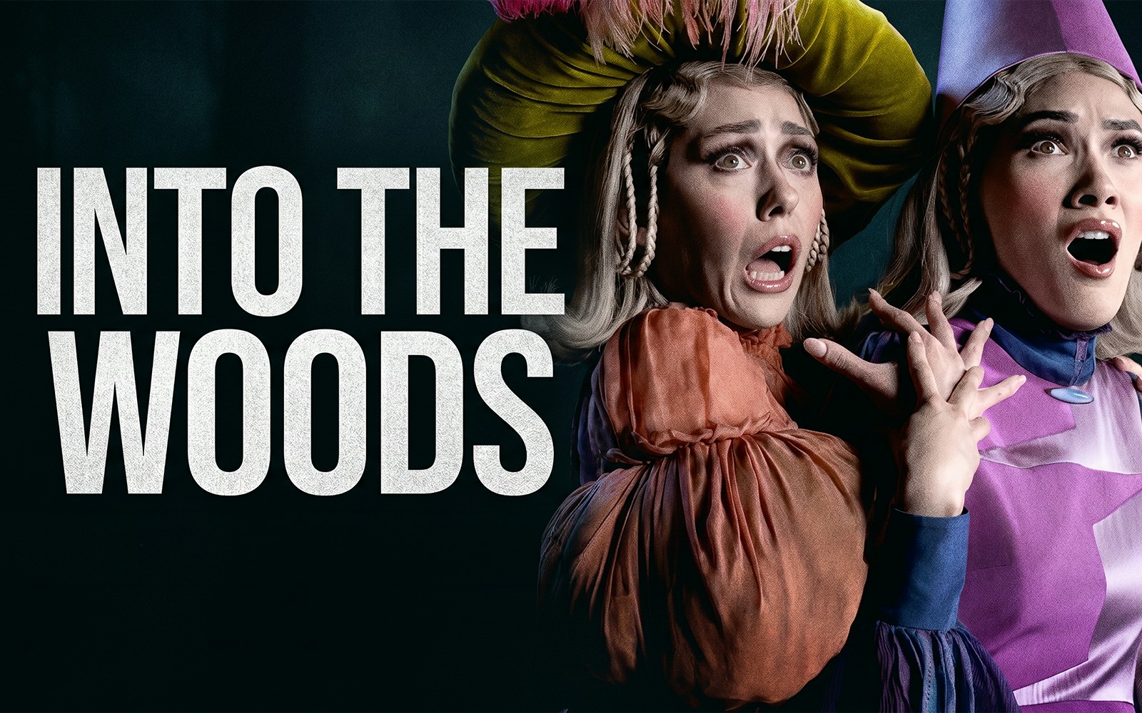 Actors in costume express surprise in a scene from "Into the Woods" musical.