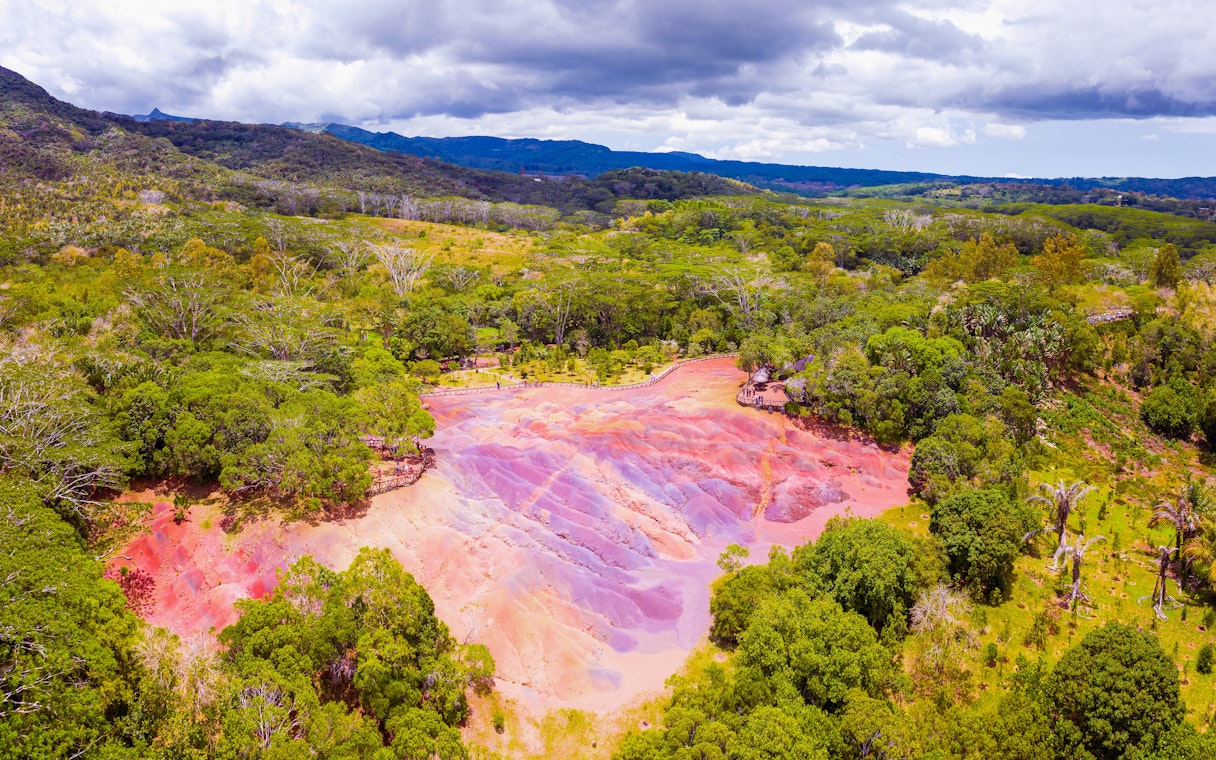 Chamarel 7 Coloured Earth Dunes surrounded by lush greenery in Mauritius.