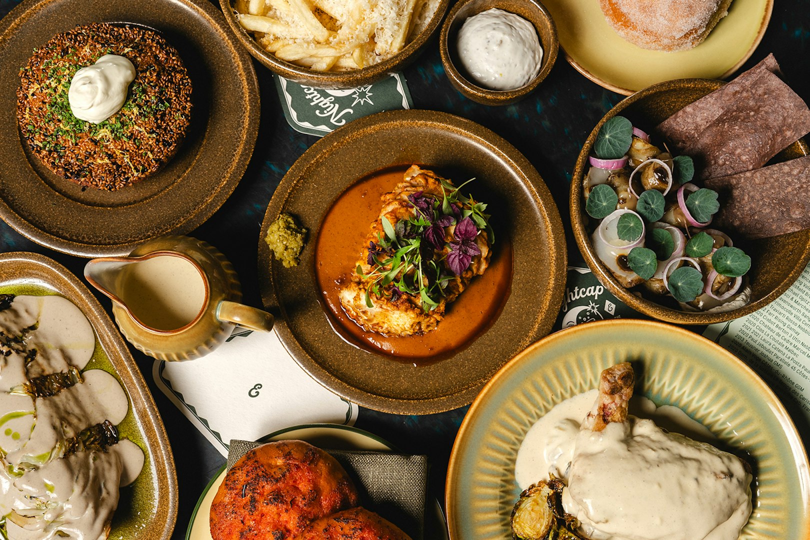 Assorted gourmet dishes at The Emerald Room party.