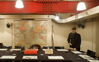 Churchill War Rooms museum with historical map and figure in uniform.