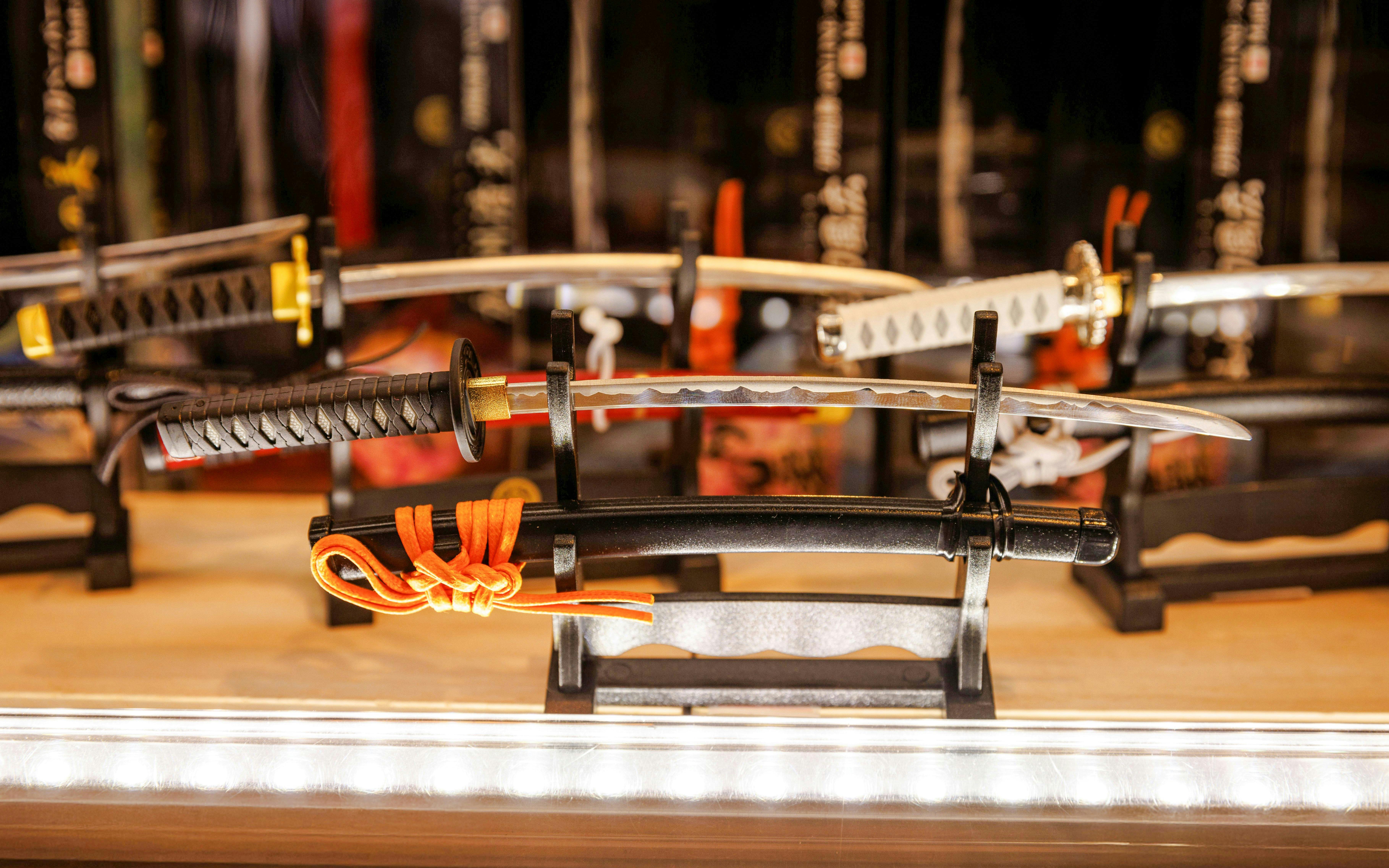 Samurai swords displayed on a rack in a shop near Les Invalides, Paris.