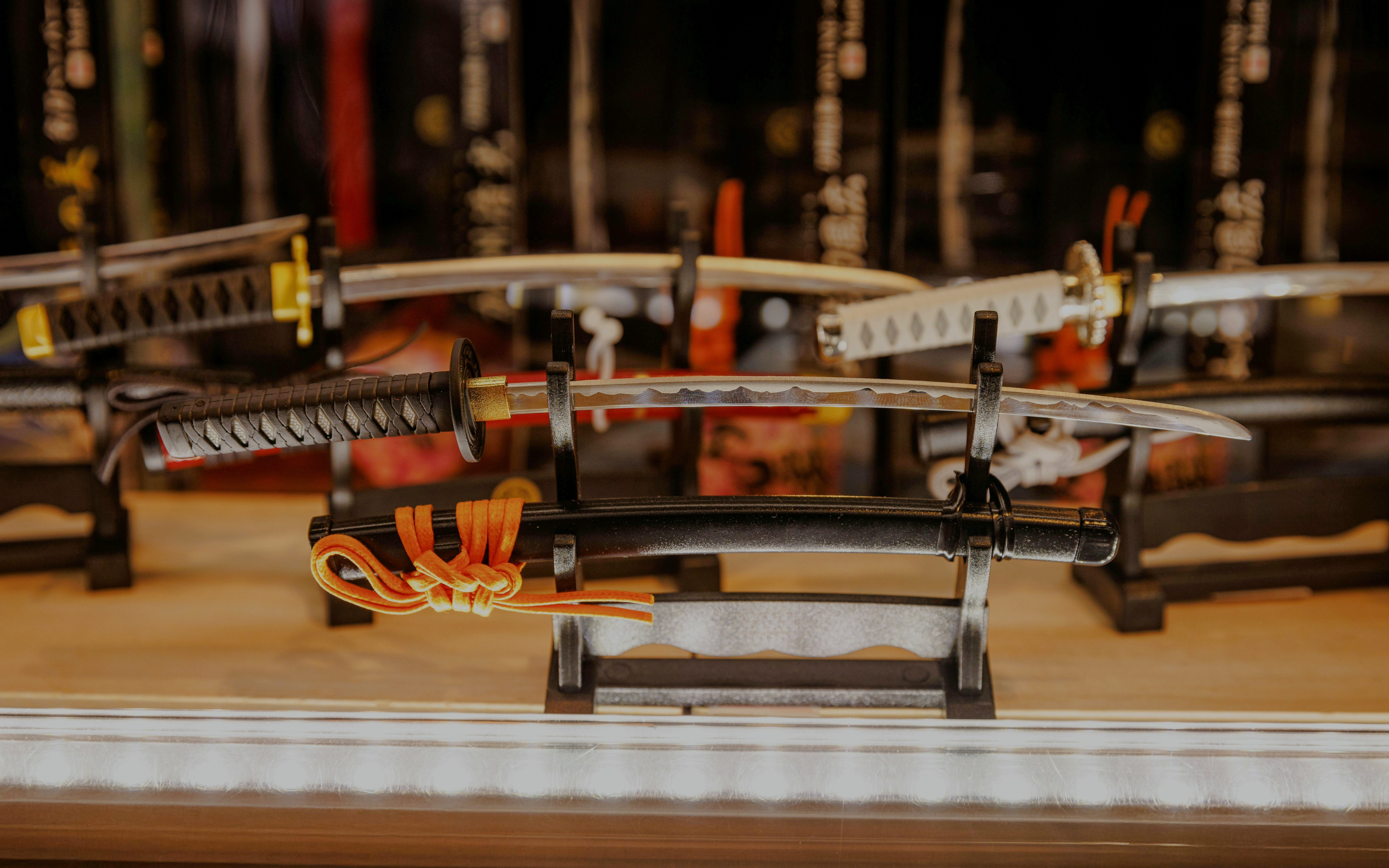 Samurai swords displayed on a rack in a shop near Les Invalides, Paris.
