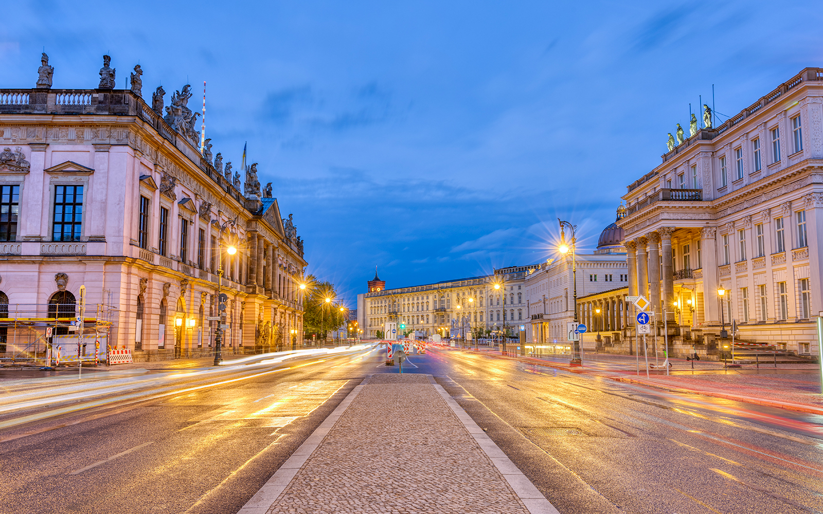 The famous Unter den Linden boulevard in Berlin with its historic buildings at night