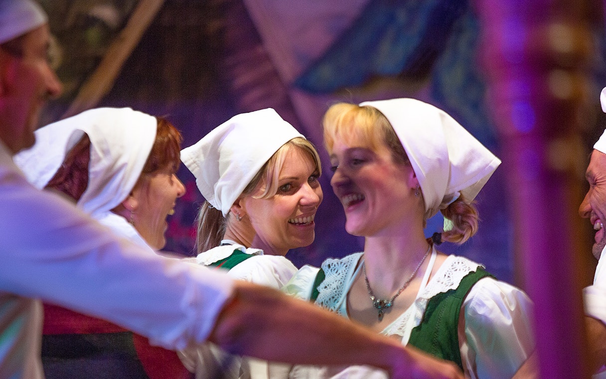 Traditional Tyrolean dancers in folk attire at the Gundolf Family show.