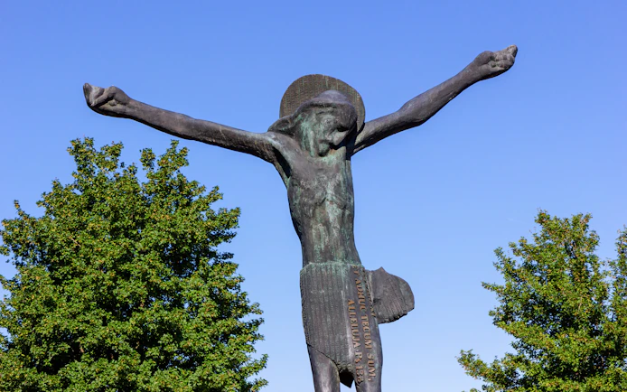 Statue of the Risen Christ with outstretched arms in Medjugorje, Bosnia and Herzegovina.