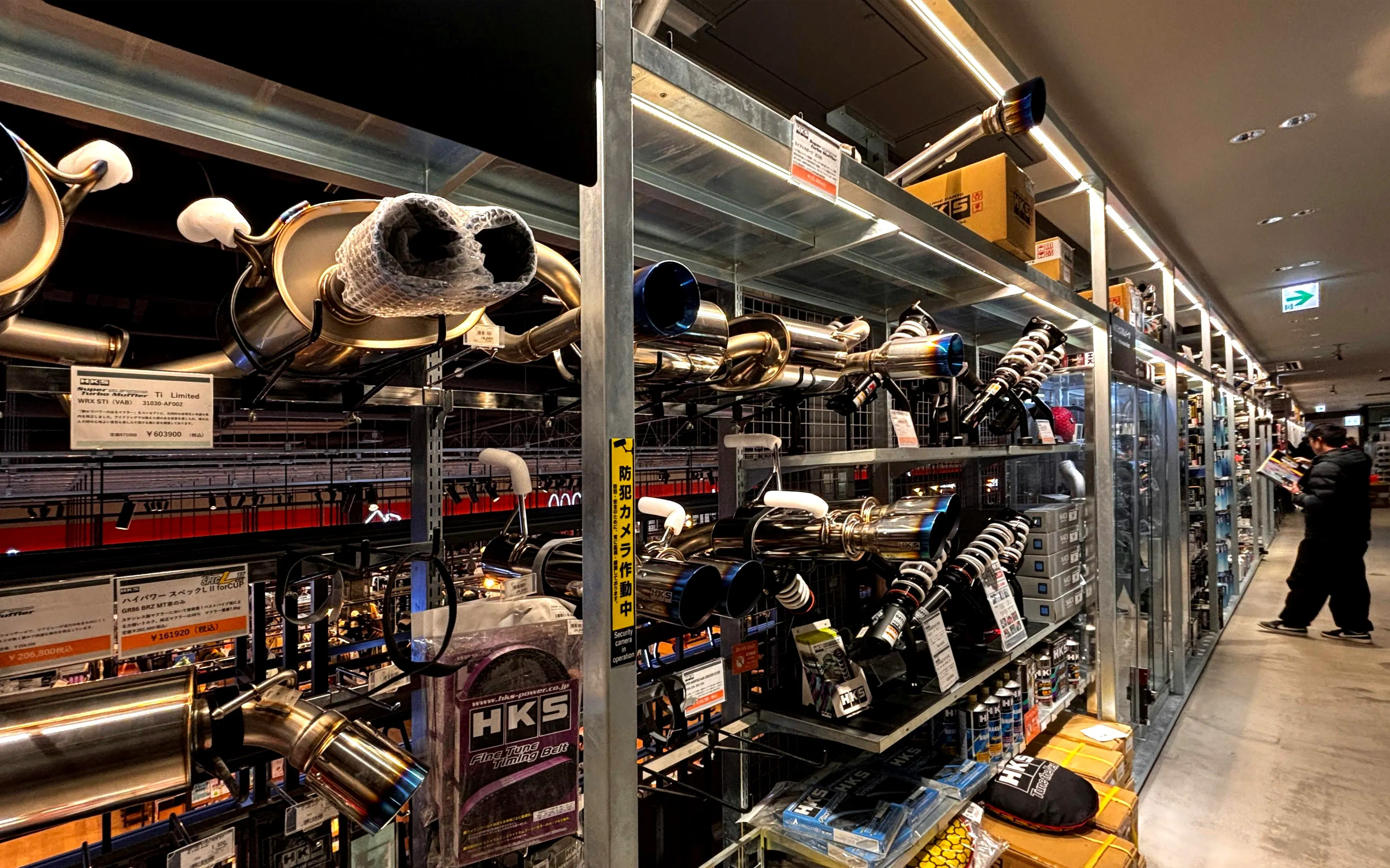 Car parts display at a Tokyo shop during JDM Tokyo Car Meetup Night Tour.