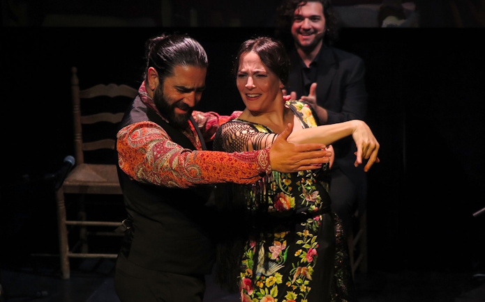 Flamenco dancers performing at Triana Theater in Seville.