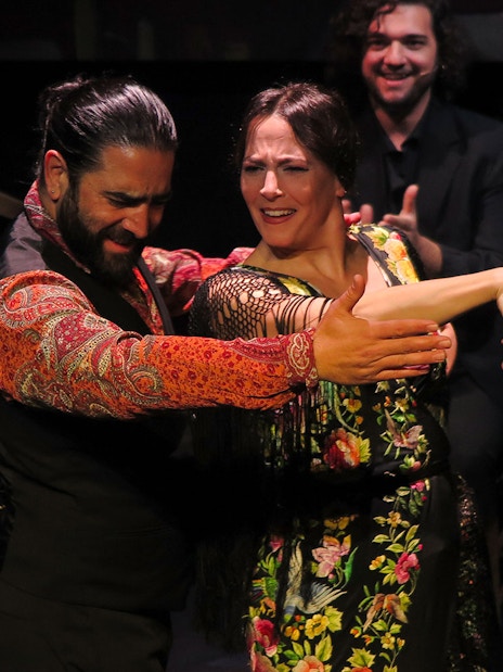 Flamenco dancers performing at Triana Theater in Seville.
