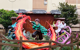 Life-sized Demon Slayer characters display with vibrant action poses.