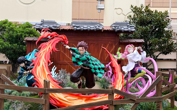 Life-sized Demon Slayer characters display with vibrant action poses.