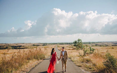 Couple walking on a rural road in Lombok during a professional photoshoot.