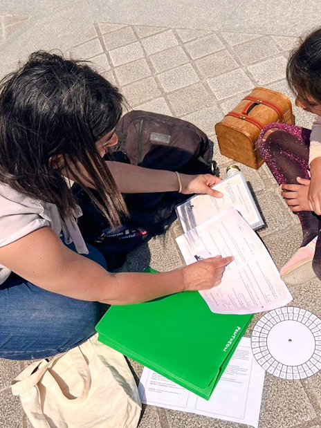 Participants solving clues during Treasure Hunt tour from Panthéon to Louvre.