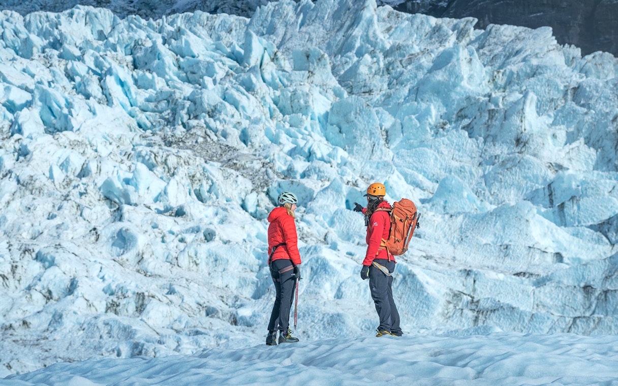 Tour guide explaining glacier features to guests during Blue Ice Experience at Skaftafell.