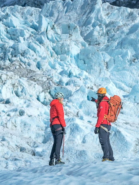 Tour guide explaining glacier features to guests during Blue Ice Experience at Skaftafell.