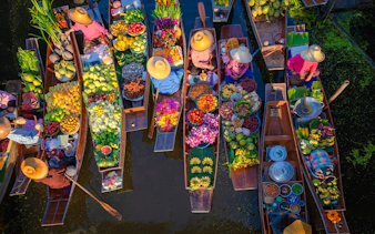 Floating market boats with fruits and flowers, Pattaya city tour.
